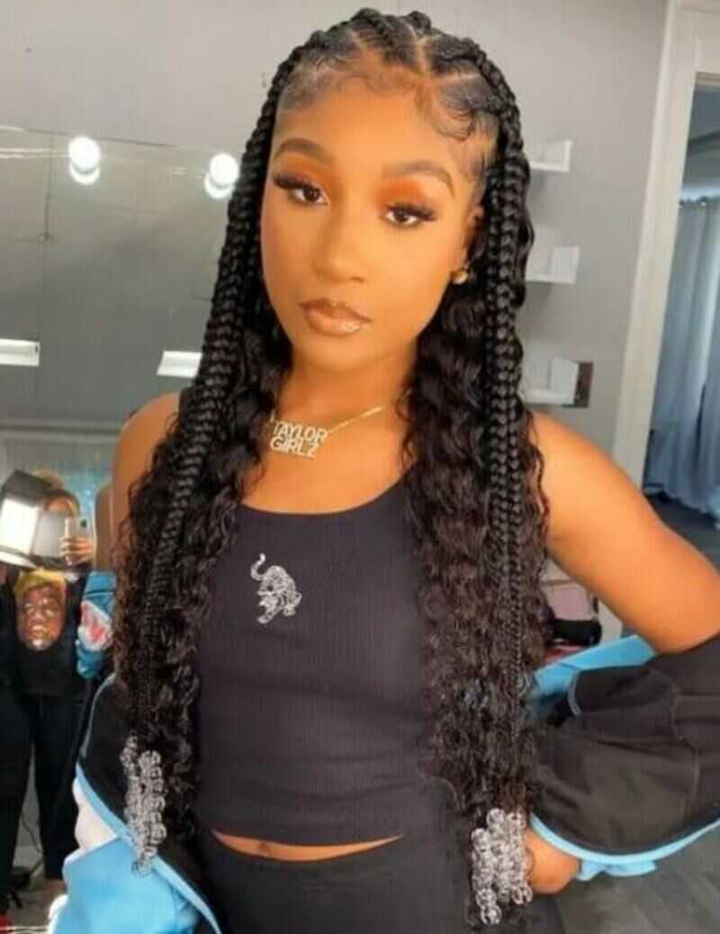 This unique and eye-catching look offers the perfect blend of braided elegance and flowing weave for a head-turning style. (Source: Black Beauty Bombshells)