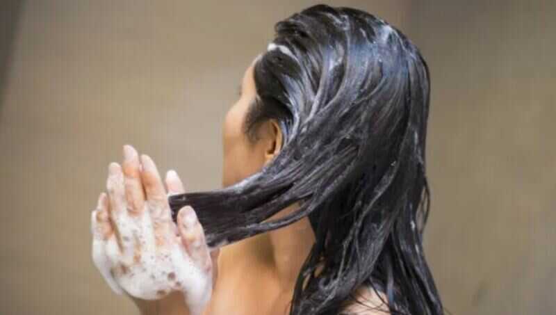 Apply a heat protectant spray or serum evenly throughout your hair, focusing on the ends. (Source: Rodan + Fields)