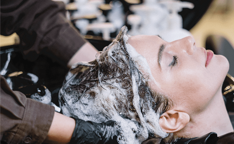 Wash your hair with shampoo to prepare for twisting dreads (Source: Medium)