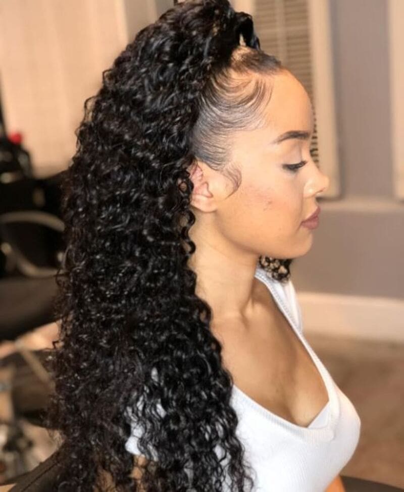 If you are incorporating a weave into your half up half down curly hair, it is important to ensure a seamless blend. (Source: Woden)