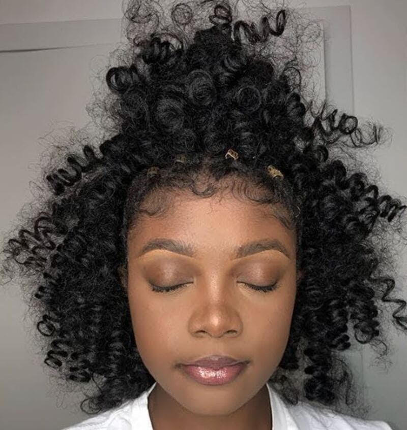 Only the section of your natural hair from the hairline to the ponytail base will be exposed. (Source: YouTube)