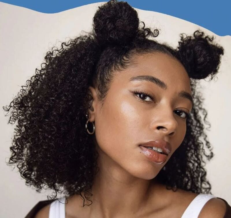 Space buns are trendy and playful choices to add a whimsy touch to your look. (Source: Glamour UK)