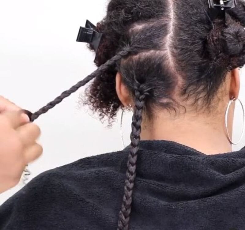 To begin, divide your natural hair for the braid-out into small. (Source: Miche Beauty)