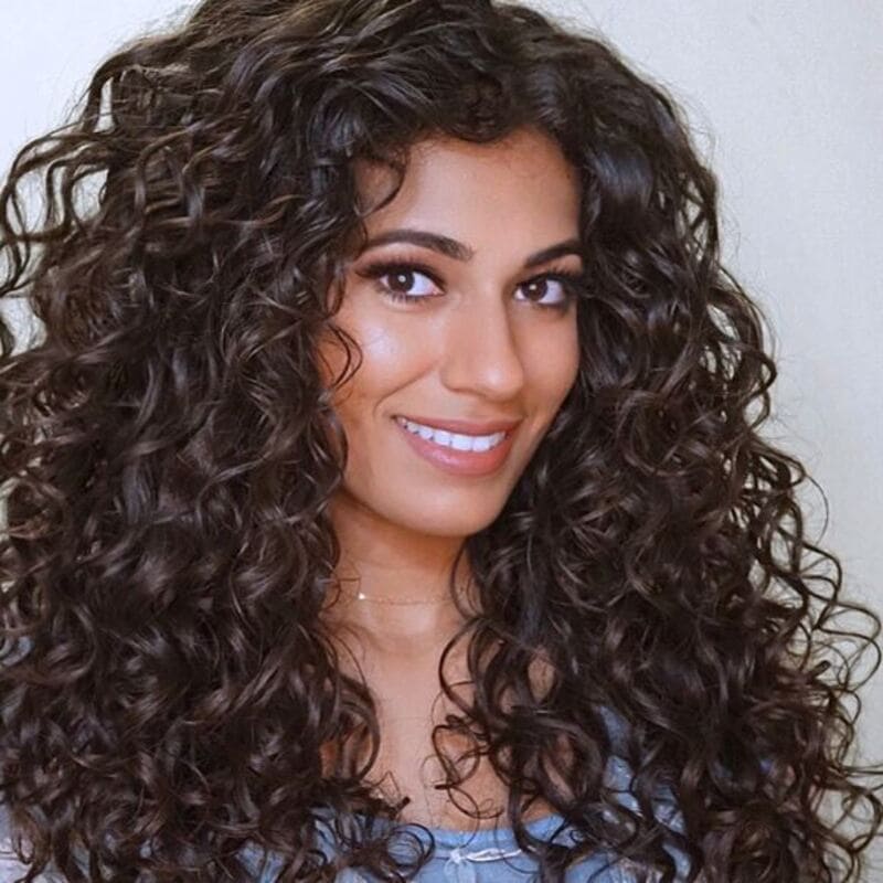 This particular style helps you achieve a similar look with a more stretched-out appearance. (Source: Naturally Curly)