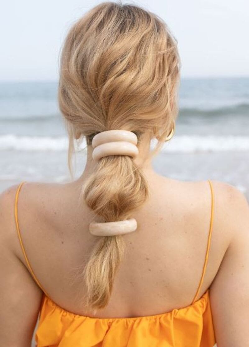 A double-tied ponytail gives you a fresh and put-together look. (Source: Pinterest)