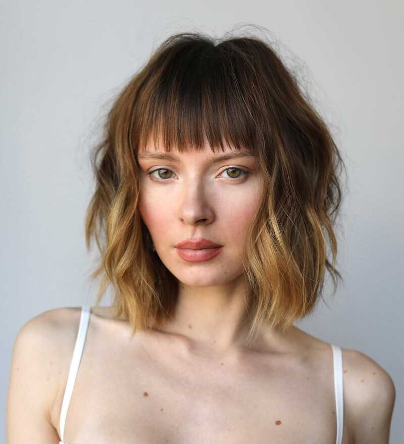 Bangs can work wonders for thin hair, adding texture and framing the face (Source: Hairstyle)