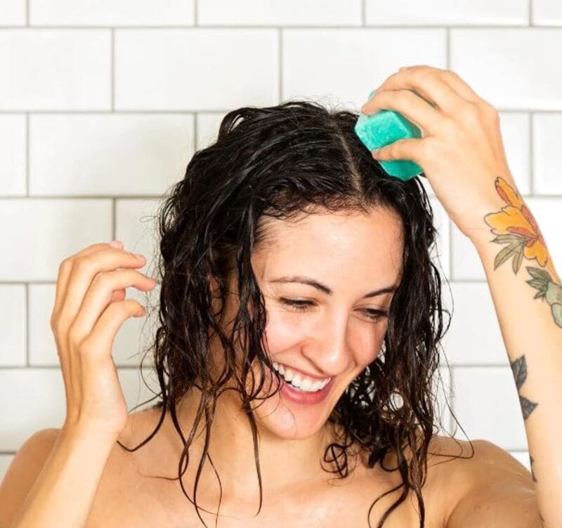 Maintaining the beauty of curtain bangs on curly hair requires regular care and occasional pampering. (Source: Neat)