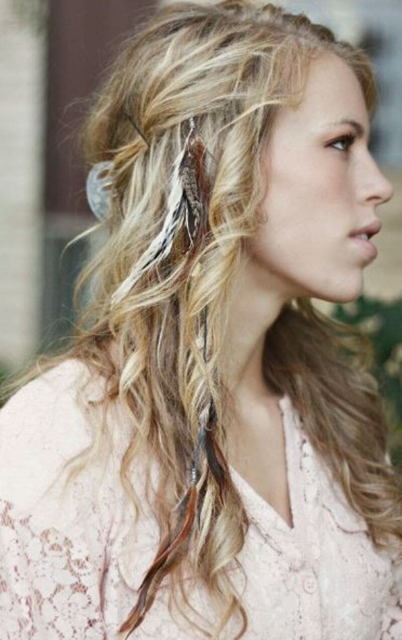 Feather hair attachments can be creatively attached into hair to create various hairstyles. (Source: Pinterest)