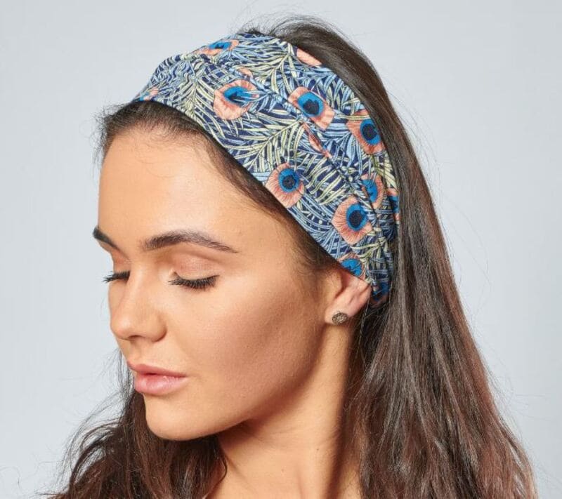 Wearing wide headbands are advantageous for hiding thinning hair. (Source: Etsy)