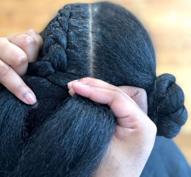 Start by crossing one section of hair over the other in a crisscross pattern. (Source: Popsugar)