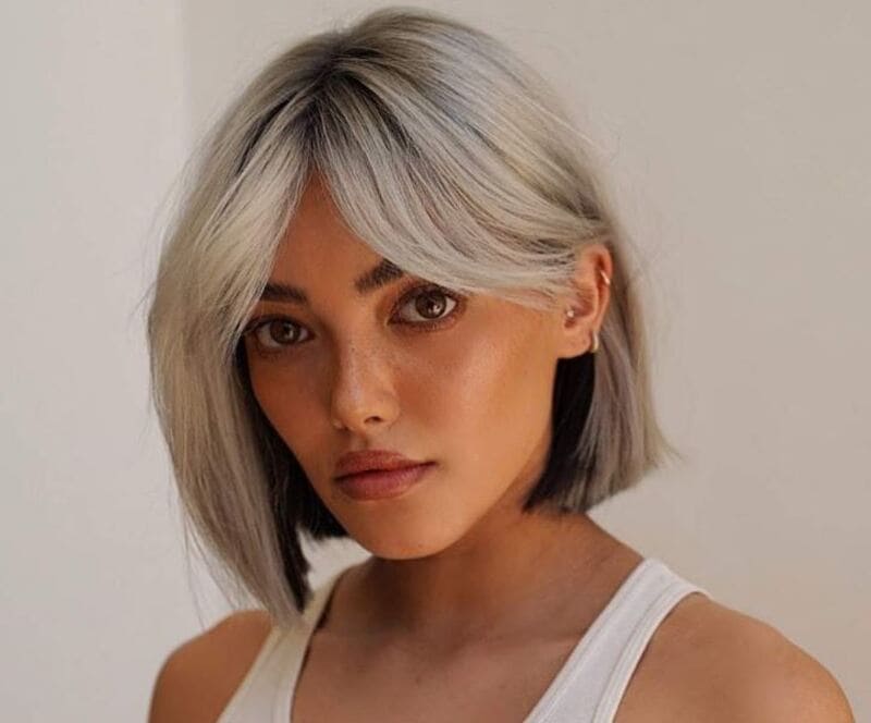 If you have short, straight-across bangs, you can definitely achieve a natural curtain bang effect. (Source: Latest-Hairstyles)