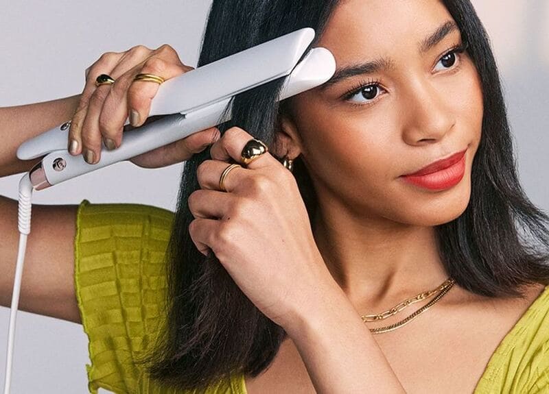 Slowly glide the flat iron downwards towards the ends of your bangs. (Source: CNN)