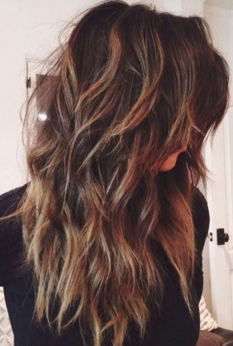 The choppy layers create texture and movement throughout your thick, long hair. (Source: Pinterest)