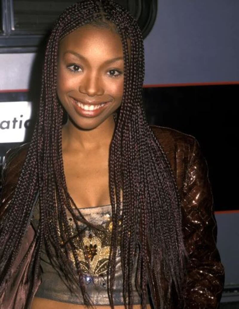 Brandy deserves credit for popularizing the trendy tiny braids style of the '90s. (Source: POPSUGAR)