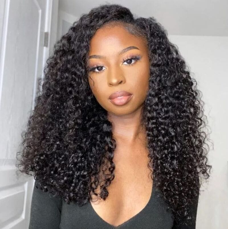 The medium curls in this particular style provide a sense of effortless beauty. (Source: AfroLovely: Black Hair Blog)