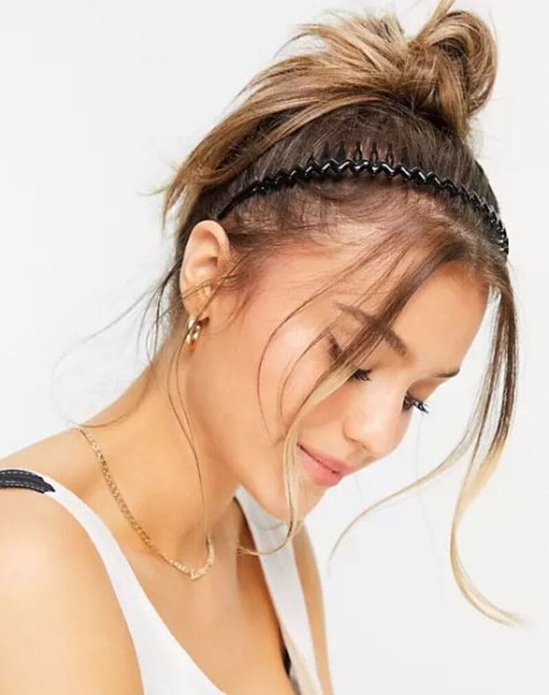 You can elevate your hairstyle game by combining the headband and claw clip. (Source: ASOS)