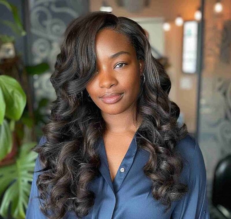 Sew-in extensions is a great option for adding length, volume, or enhancing your natural curls. (Source: Latest-Hairstyles)