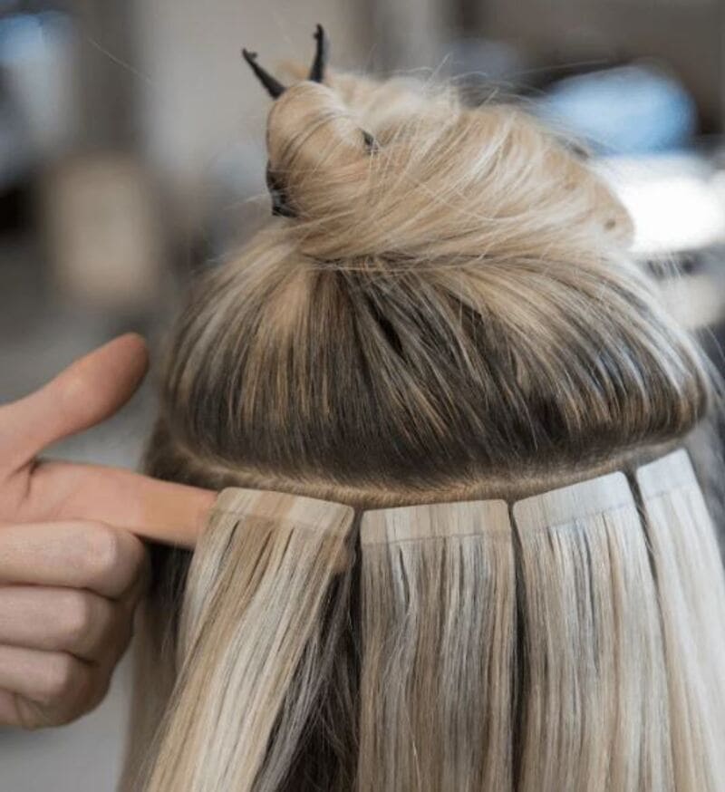 Tape-in extensions are attached to your natural hair using tape. (Source: Stranded Hair Group)