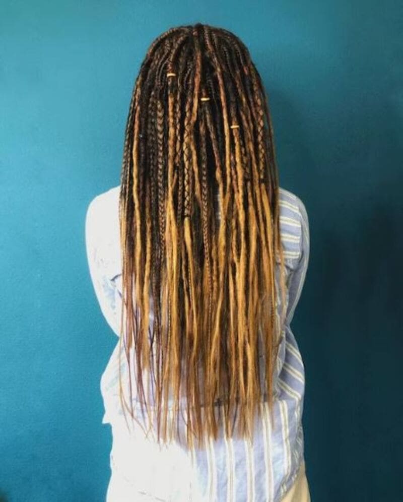 Ombre hair coloring and dreadlocks create a captivating and unique hairstyle. (Source: Etsy)