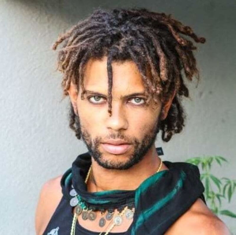 Colored dreads enable men to break away from traditional norms and embrace their true selves. (Source: Hairstyle Camp)