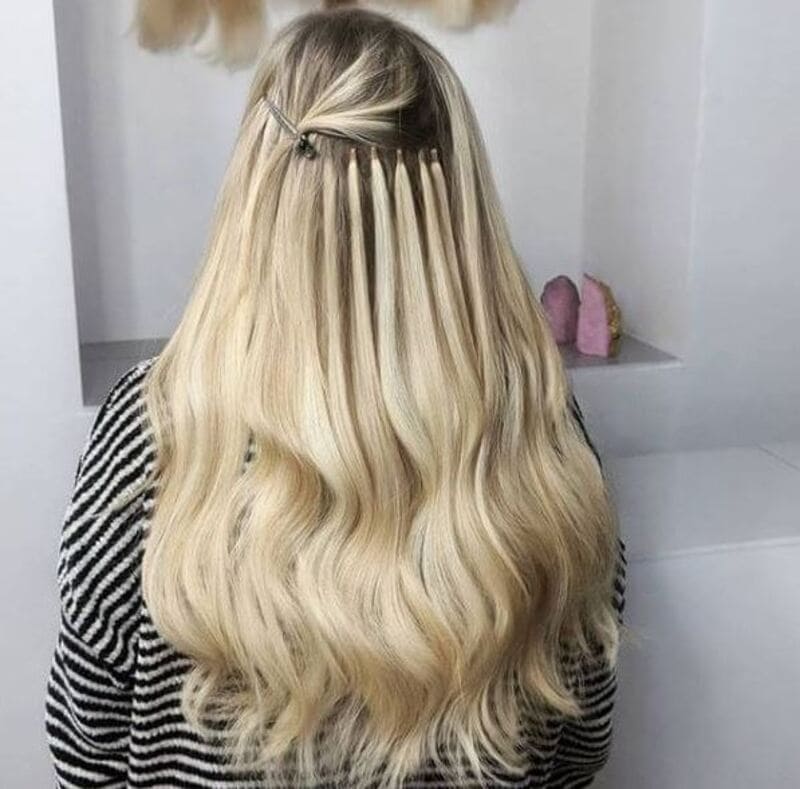 It is essential to choose a reputable and experienced professional for extension application. (Source: The Hair Alchemist)