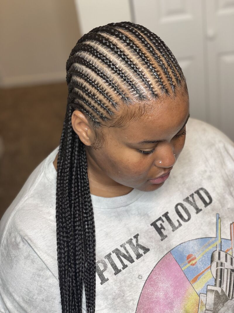 This classic pattern involves braiding the hair neatly in rows (Source: Insta @the_aceofbraids)