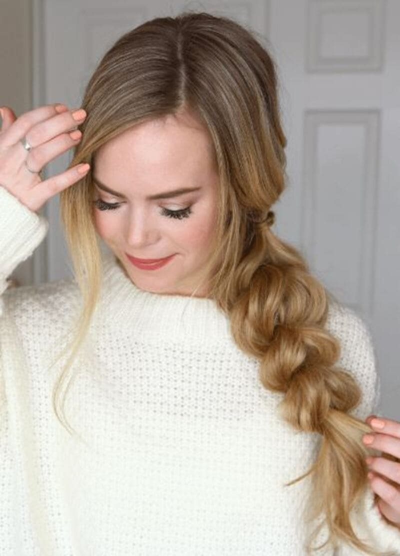 Show off your gorgeous long hair with a voluminous pull-through side braid. (Source: MISSY SUE)