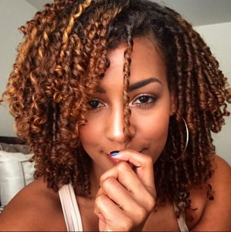 Finger twists involve wrapping a single section of hair around itself following its natural curl pattern. (Source: Pure Hair Gaze)