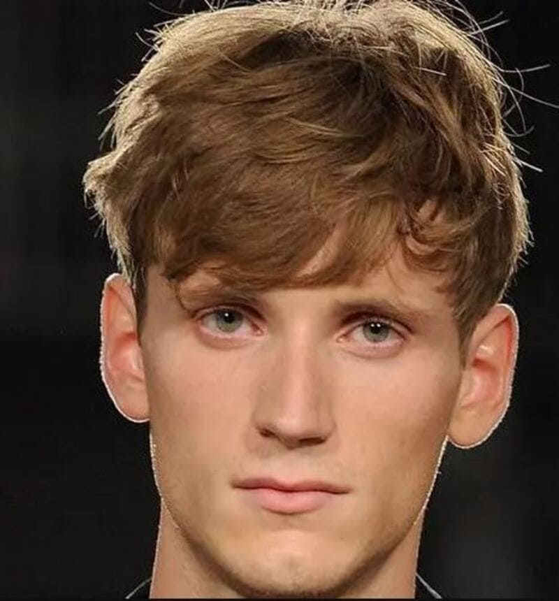 A feathered fringe is a wonderful way to add volume to the front of your hair. (Source: Men Hairstyles World)