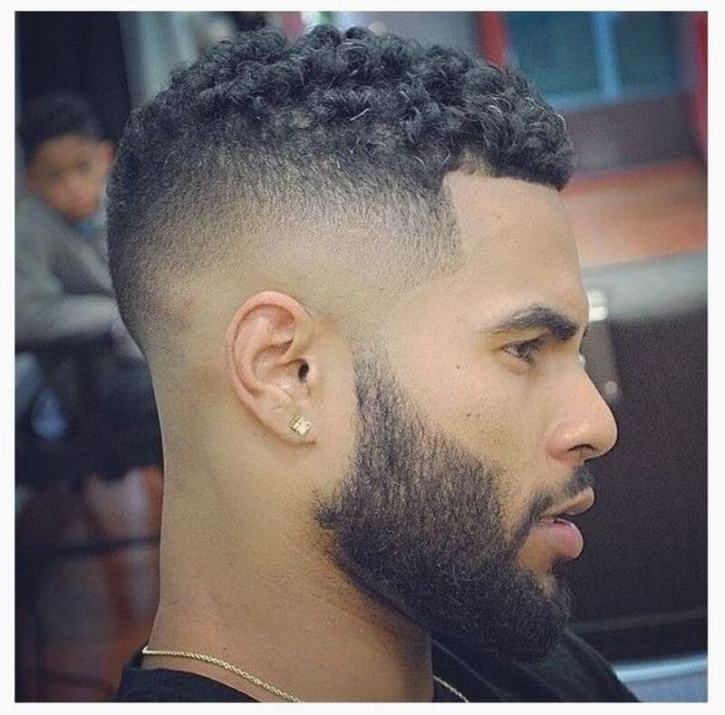 Traditional Puerto Rican hairstyles for males often incorporate elements like tight fades, intricate patterns, and perfectly sculpted lines. (Source: Pinterest)