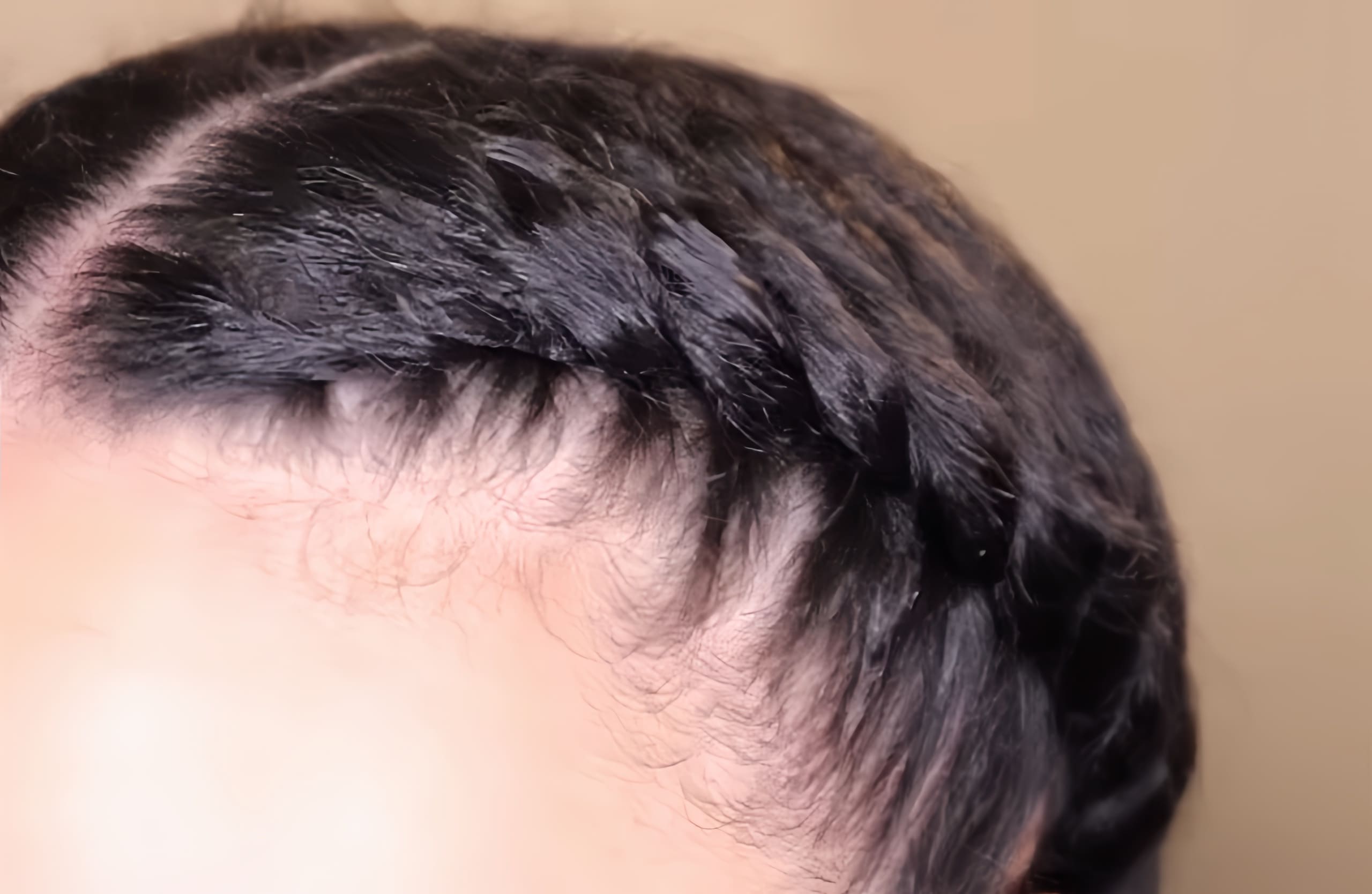 You create flat twists on the front sections of your hair (Source: Youtube @AbbieCurls)