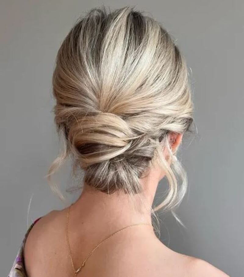 A neat twisted and tucked updo combines a relaxed appearance with elegance. (Source: The Right Hairstyles)