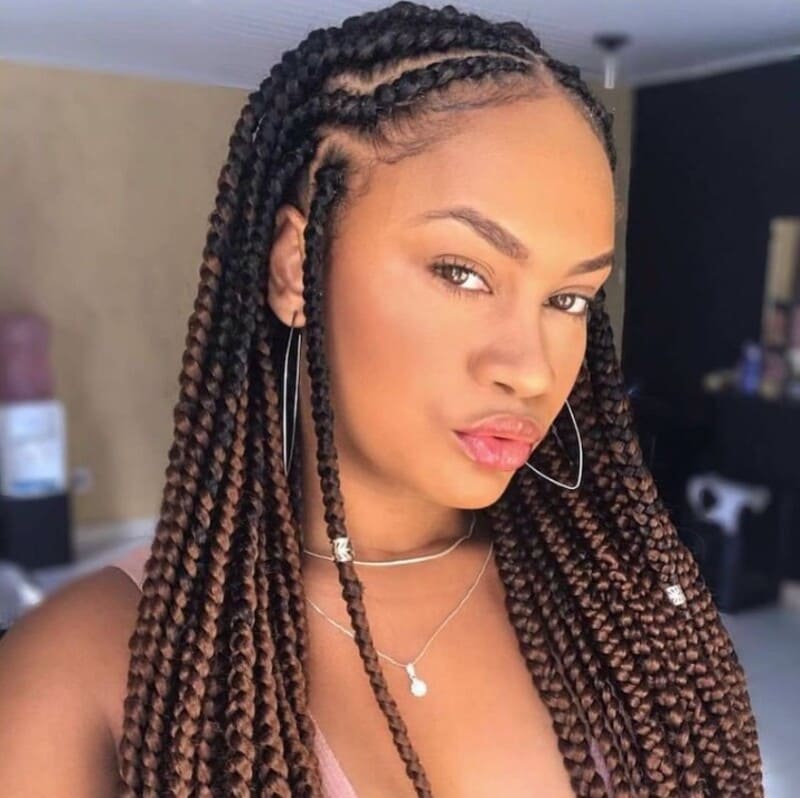 Goddess feed in braids have hair extensions added or "fed" into individual loose braids to create extra length and volume. (Source: Byrdie)