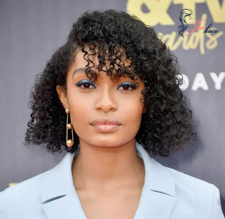 Yara Shahidi elegantly styled her retro hair with aqua eyeshadow and geometric accessories (Source: Frazer Harrison)