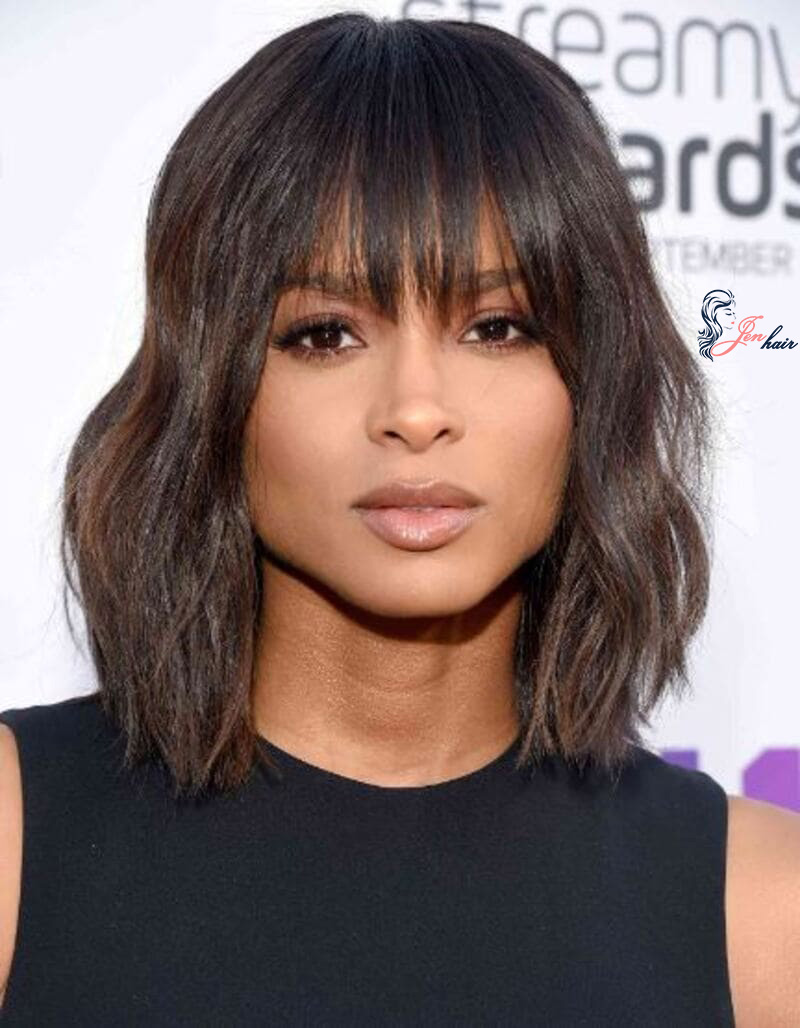 You will find a short, sleek haircut with precision-trimmed bangs 