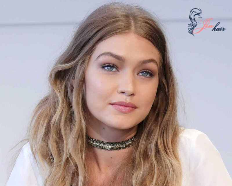 Gigi Hadid’s dirty blonde hair goes well with her blue eyes and makeup tone