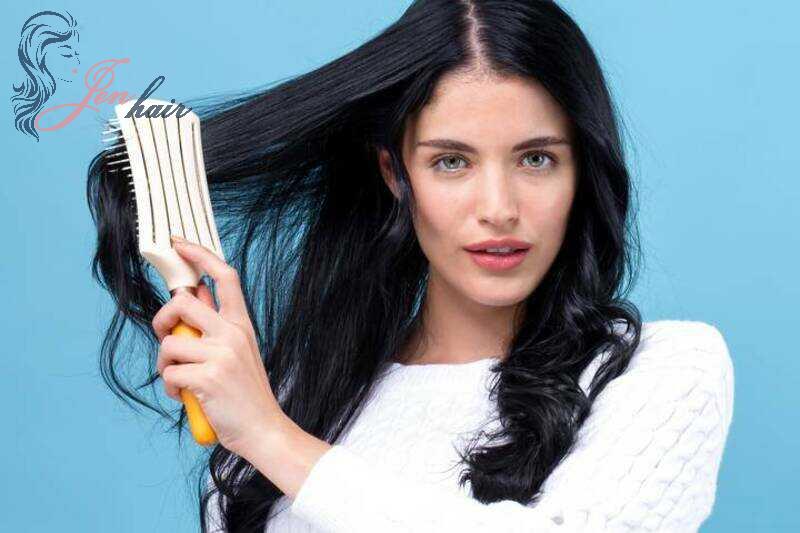 Using a wide-tooth comb to comb your wet hair