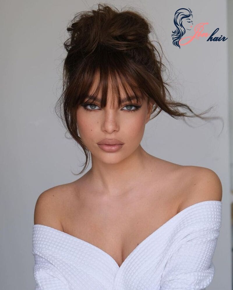 Who knows a messy bun with bangs will be elegant and timeless like this?